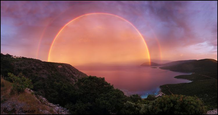 Photo: sunset over Samos with red glow and purple sky and sea