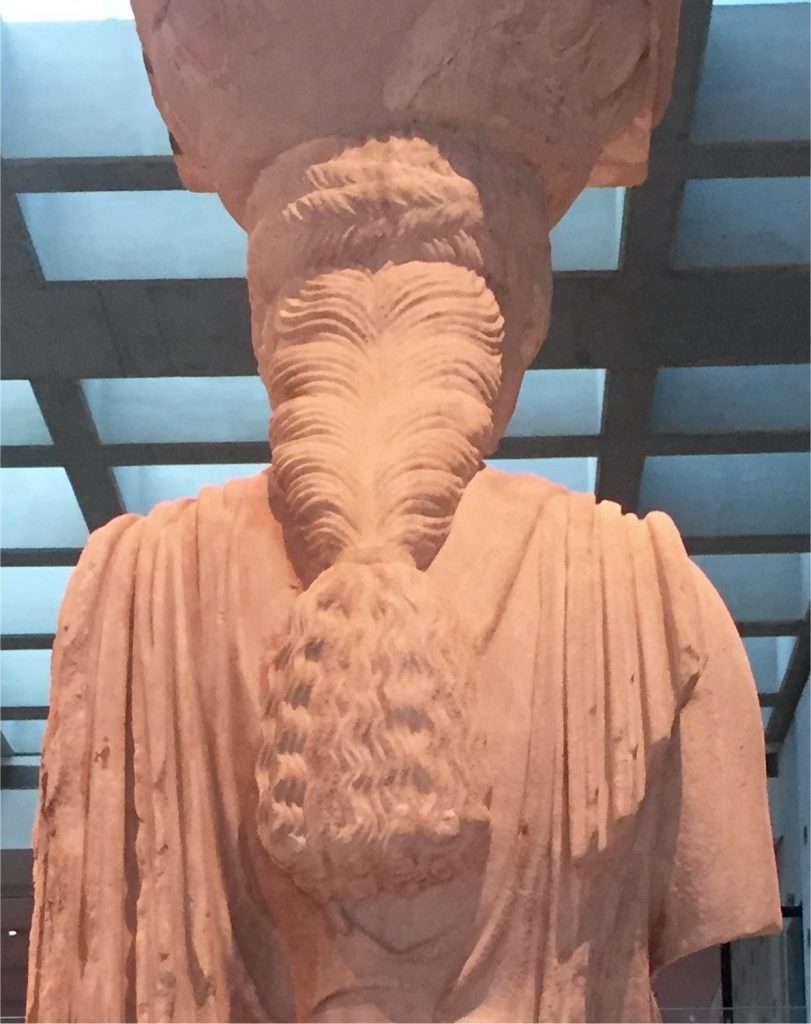 Caryatid with long braided hair