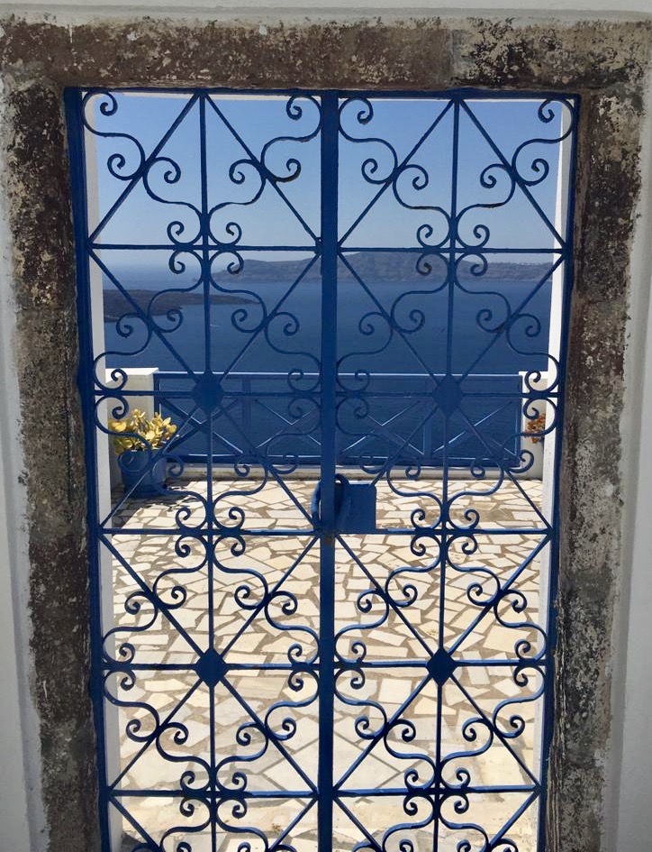view of the sea through a door