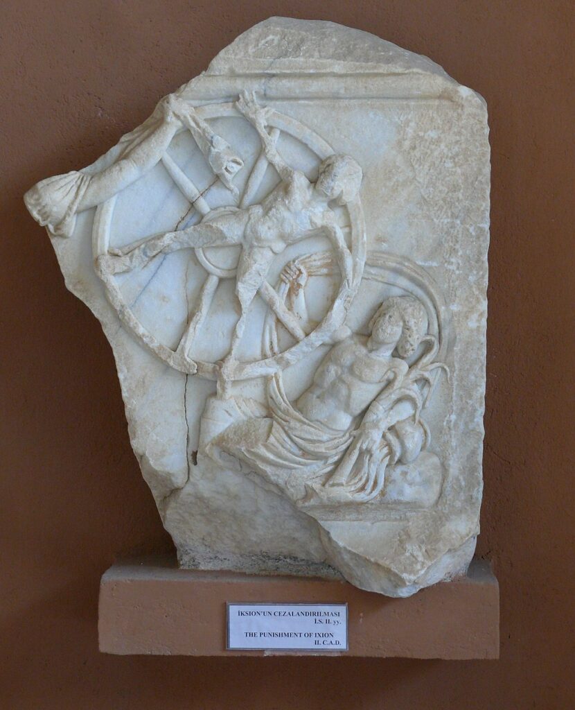 Relief carving of Ixion bound to the wheel