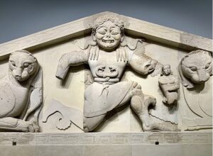 Sculpture of Gorgon on the pediment of the temple of Artemis in Corfu